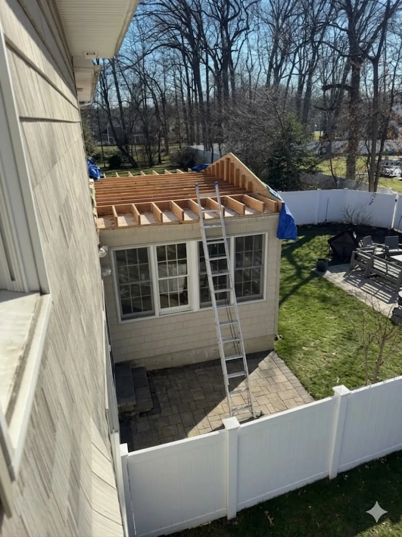 Open framing wrapped in weather-tight Tyvek shell — before